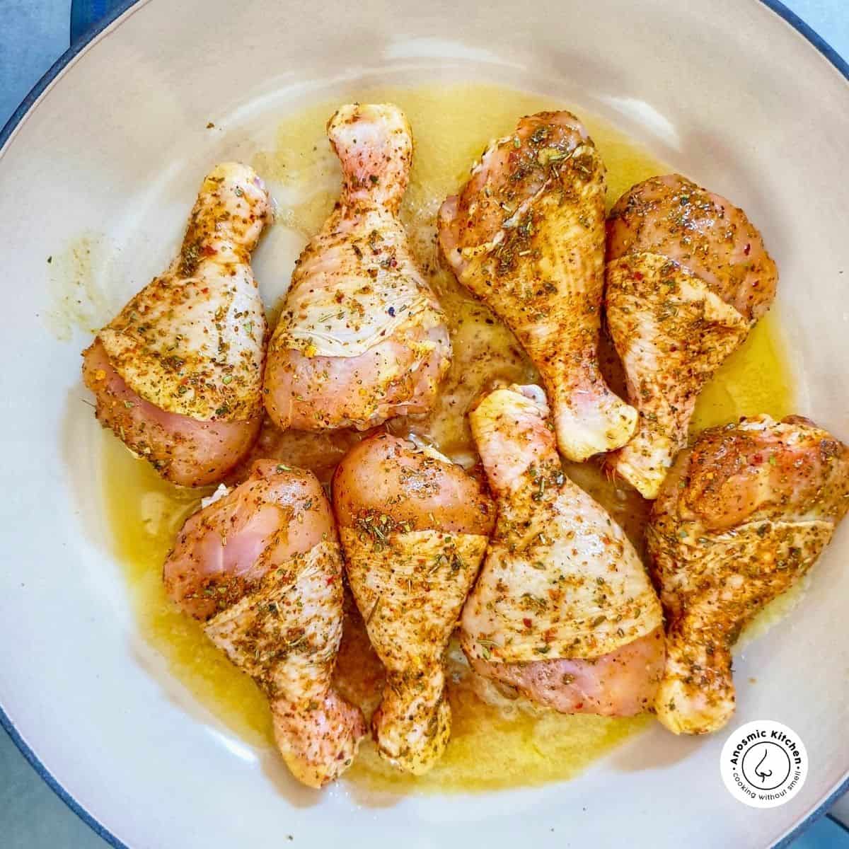 chicken drumsticks inside a skillet