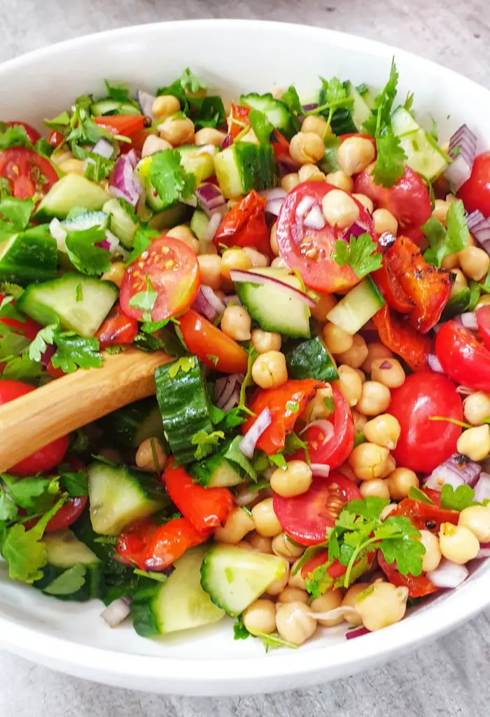 chickpea salad with tomatoes, cucumber and red onion