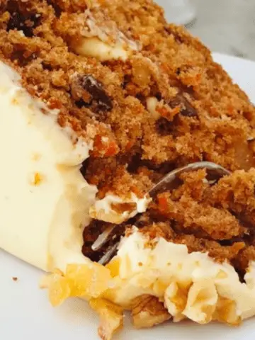 carrot cake made with crystalized ginger, walnuts and dates, topped with a mascarpone cream cheese frosting.