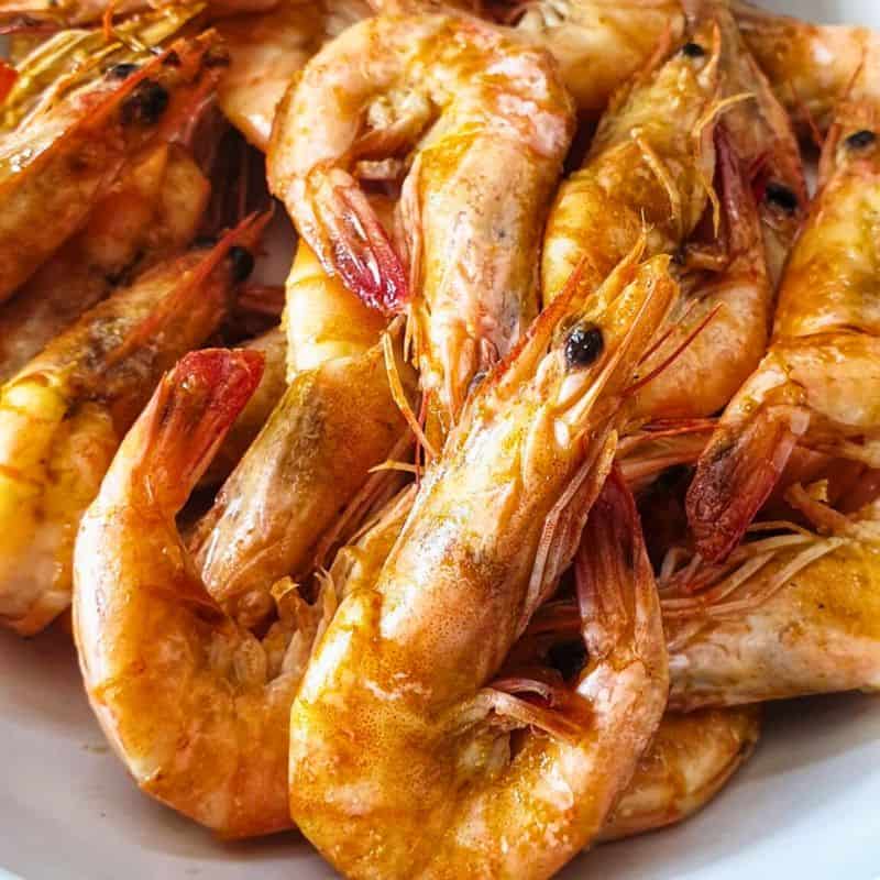 cooked prawns showing a deep pink, orange color