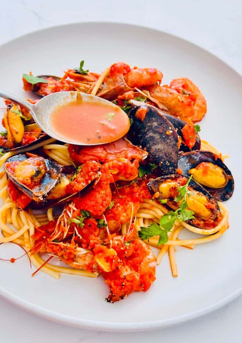 seafood marinara with mussels and shrimp over spaghetti