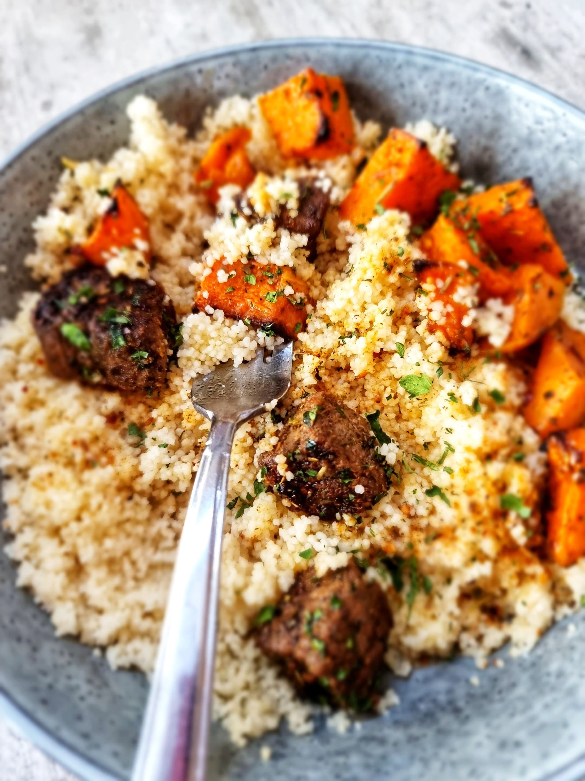 beef cubes and squash over couscous
