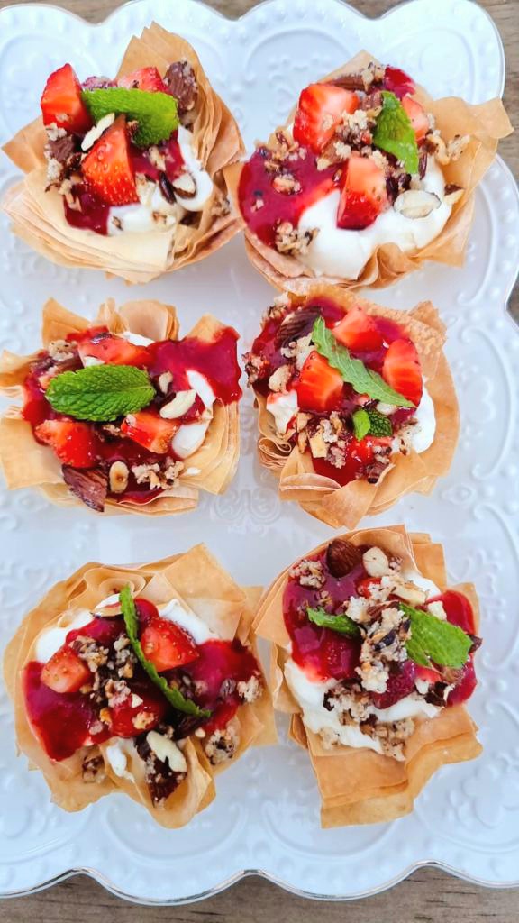 phyllo pastry baked cups filled with strawberry coulis, nuts and fresh mint.