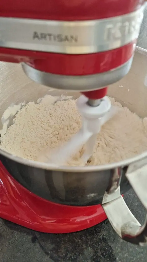 flour in kitchen aid stand mixer with paddle attachment for simple scones recipe
