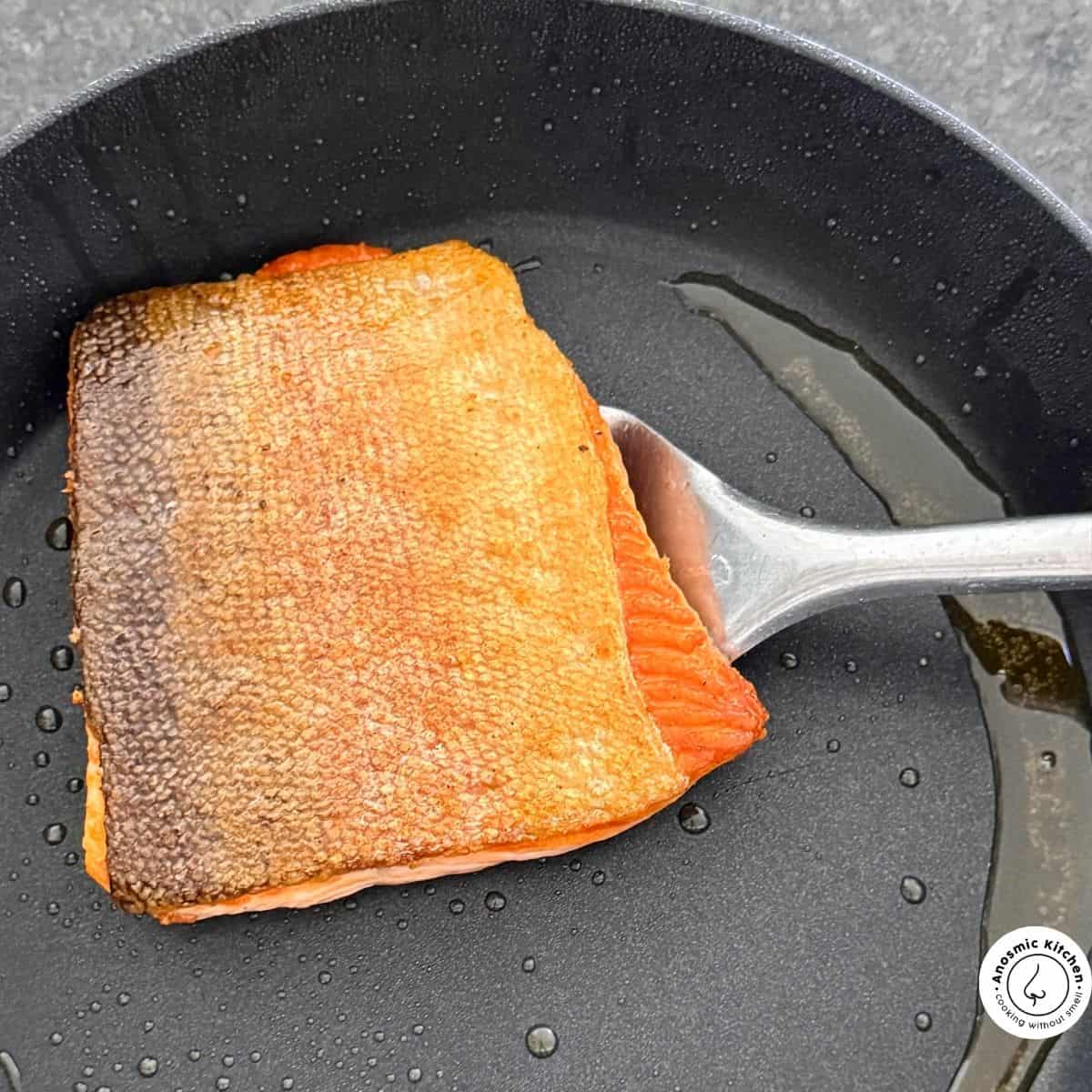 cooking salmon in pan