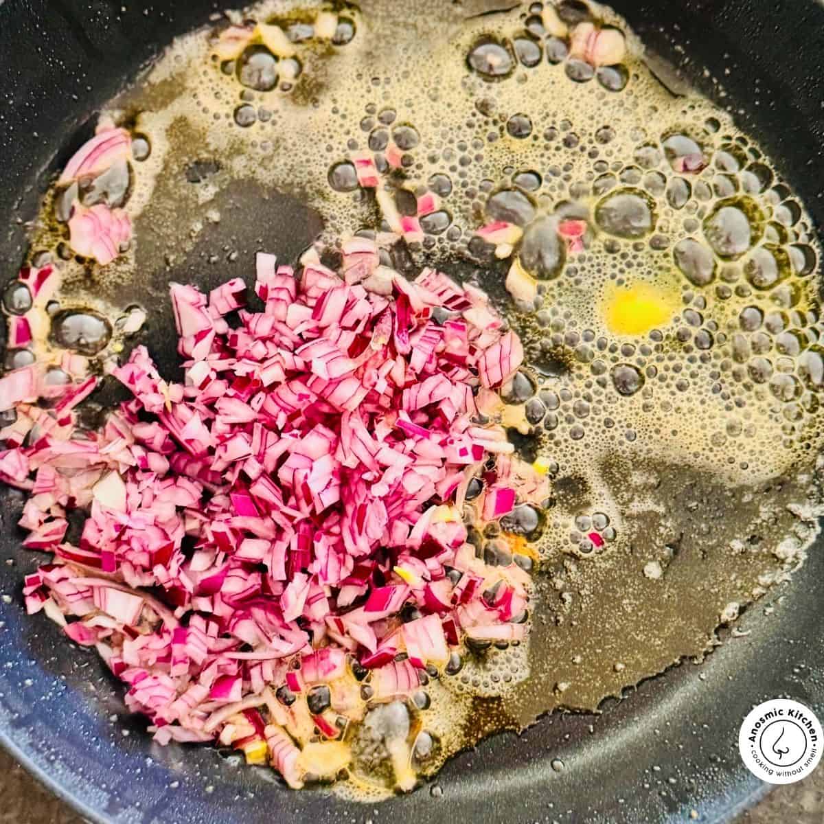 onions and butter frying in a pan