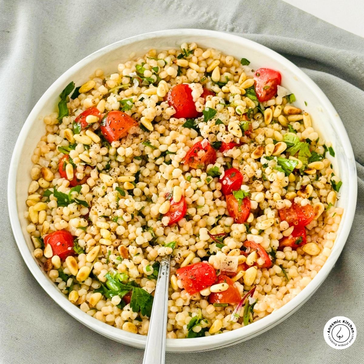 Pearl couscous salad with cherry tomatoes