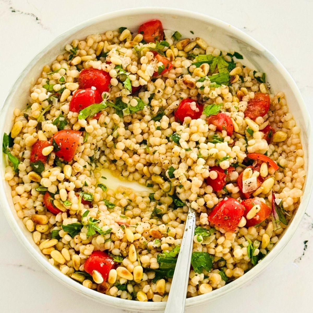 pearl couscous with cherry tomatoes and pine nuts