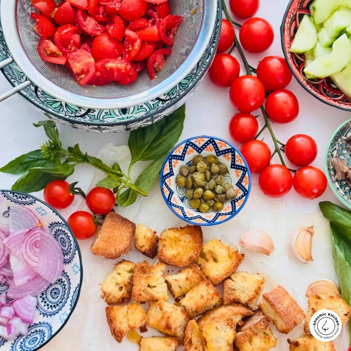 draining tomatoes for tuscan salad