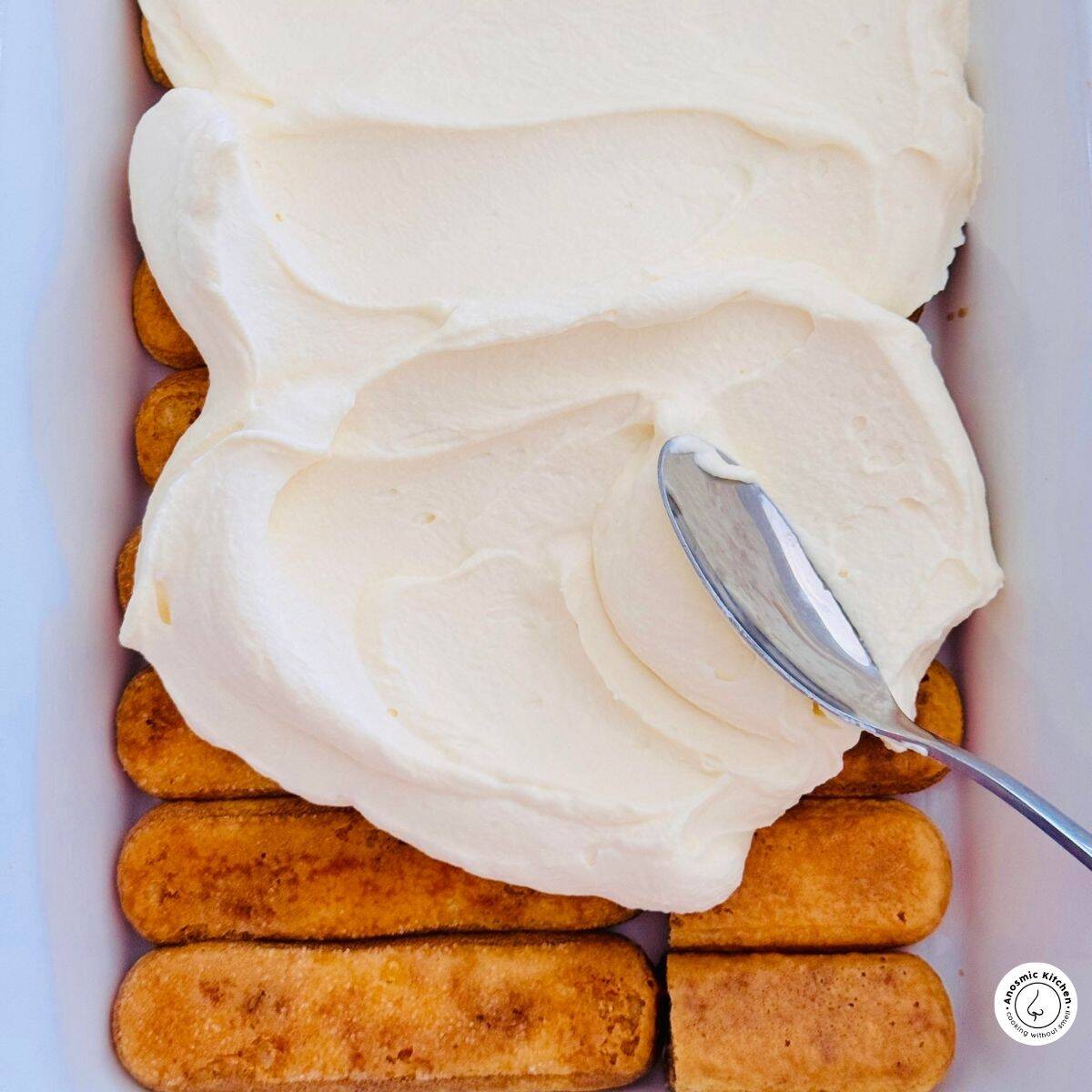 cream over coffee soaked lady fingers