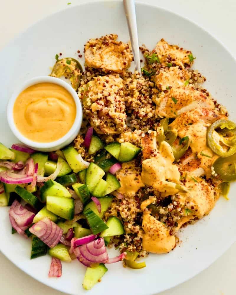 5 minute sauce in a small bowl with chicken and couscous