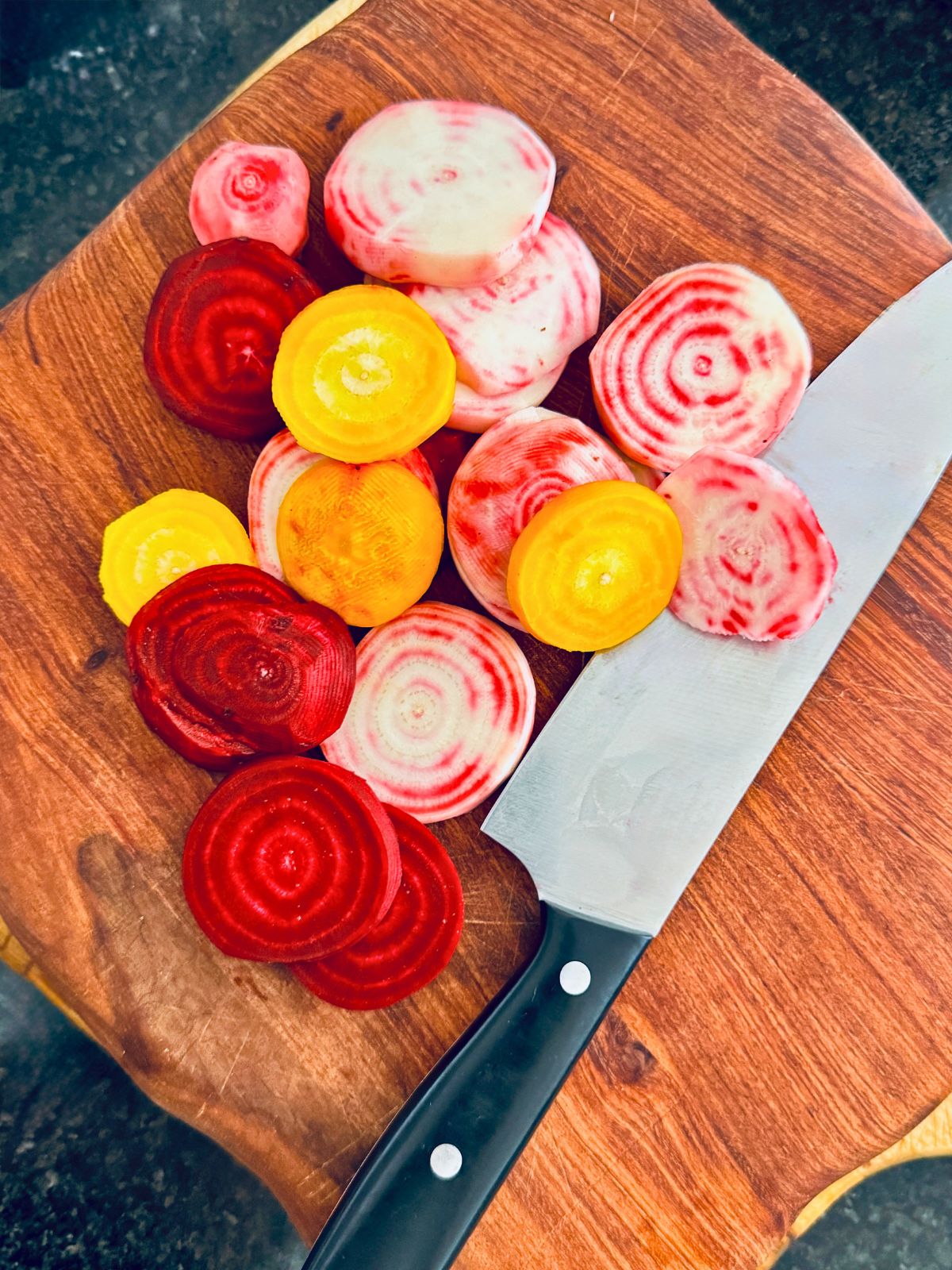 beetroot slices on a board with a slicing knife