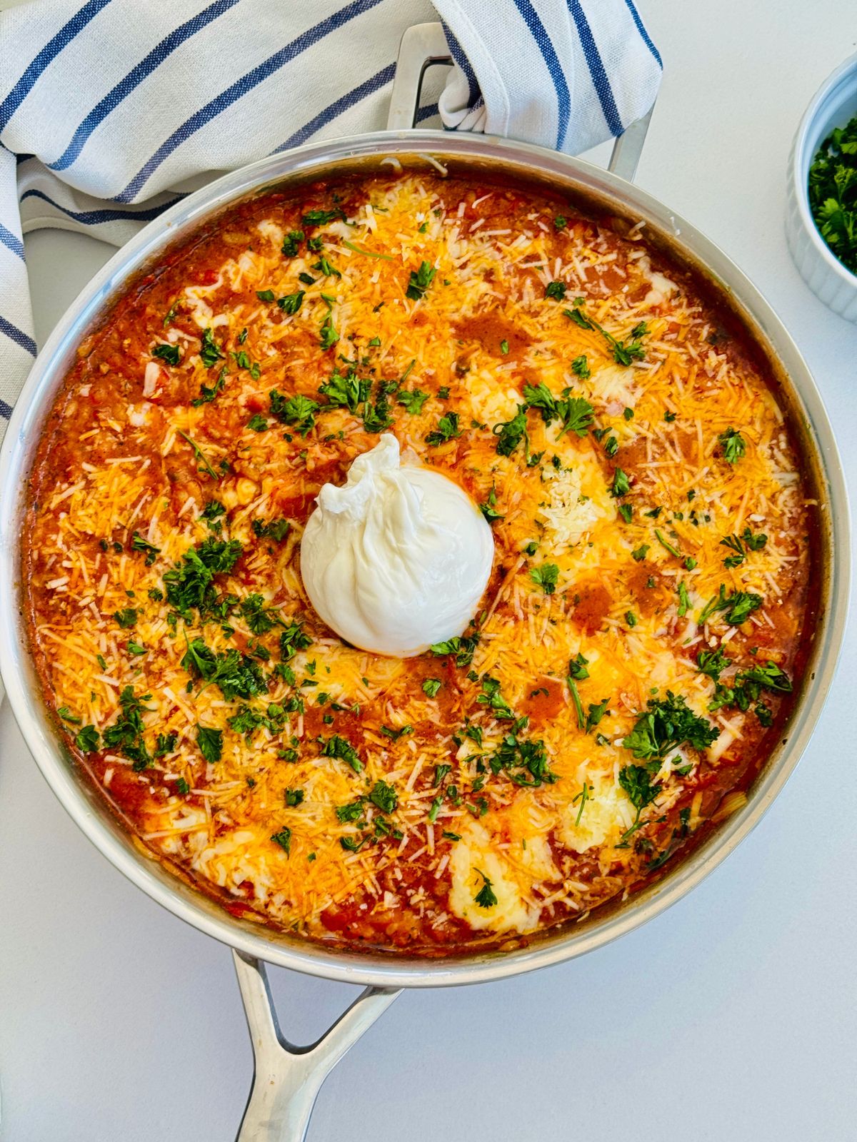 baked tomato risotto with fresh burrata cheese in the middle