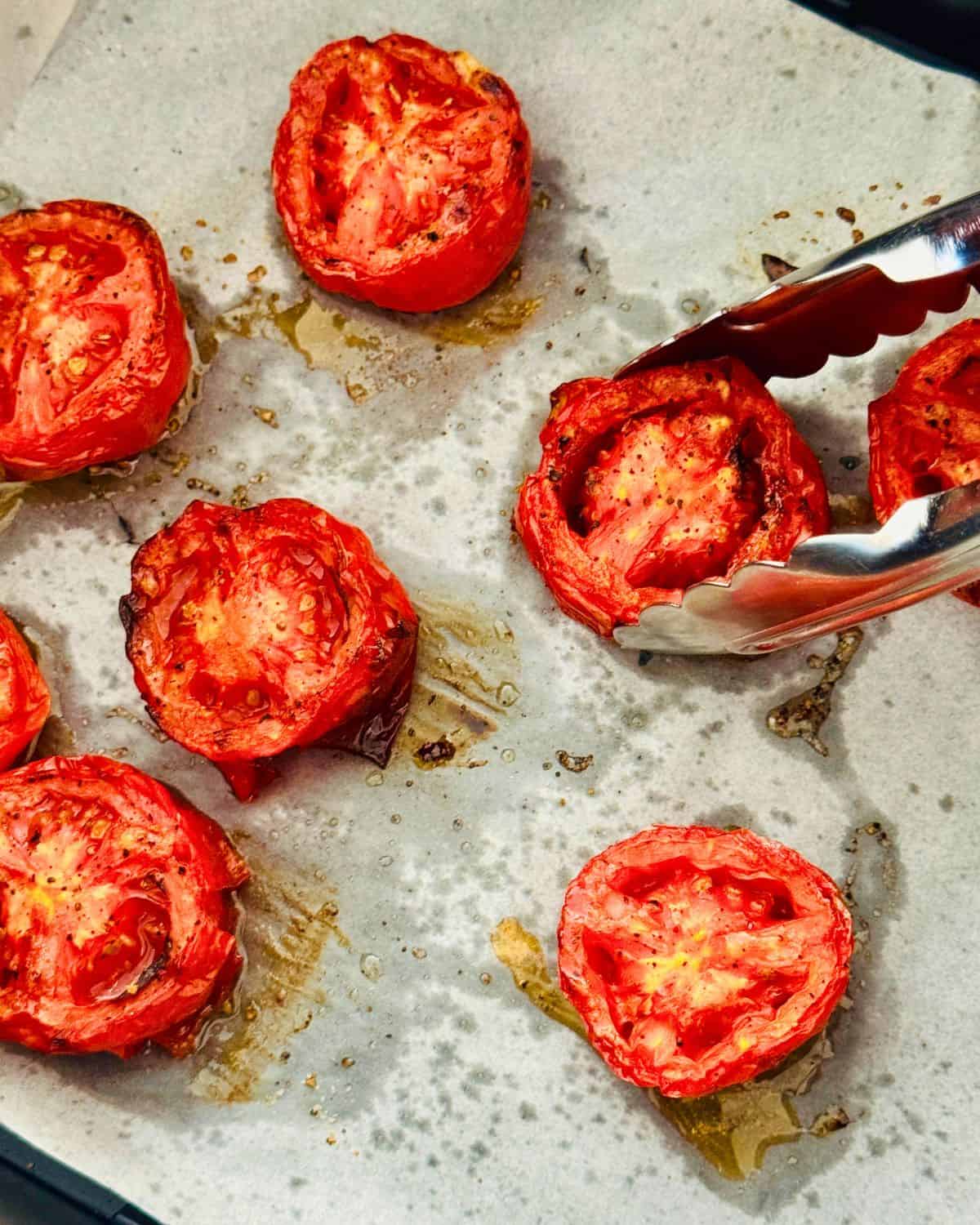 roasted air fryer tomatoes on parchment paper