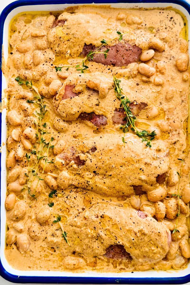 chicken and beans in sauce ready to be oven baked.